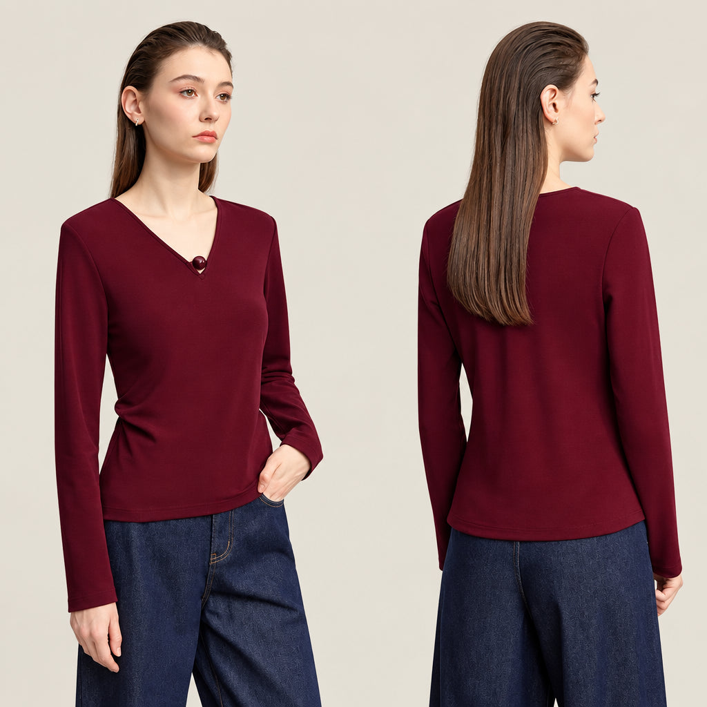 A model shown from the front and back wearing a long-sleeve V-neck knit top in deep burgundy, paired with dark blue jeans. The brand name 'AMII' is printed in black in the top-left corner.